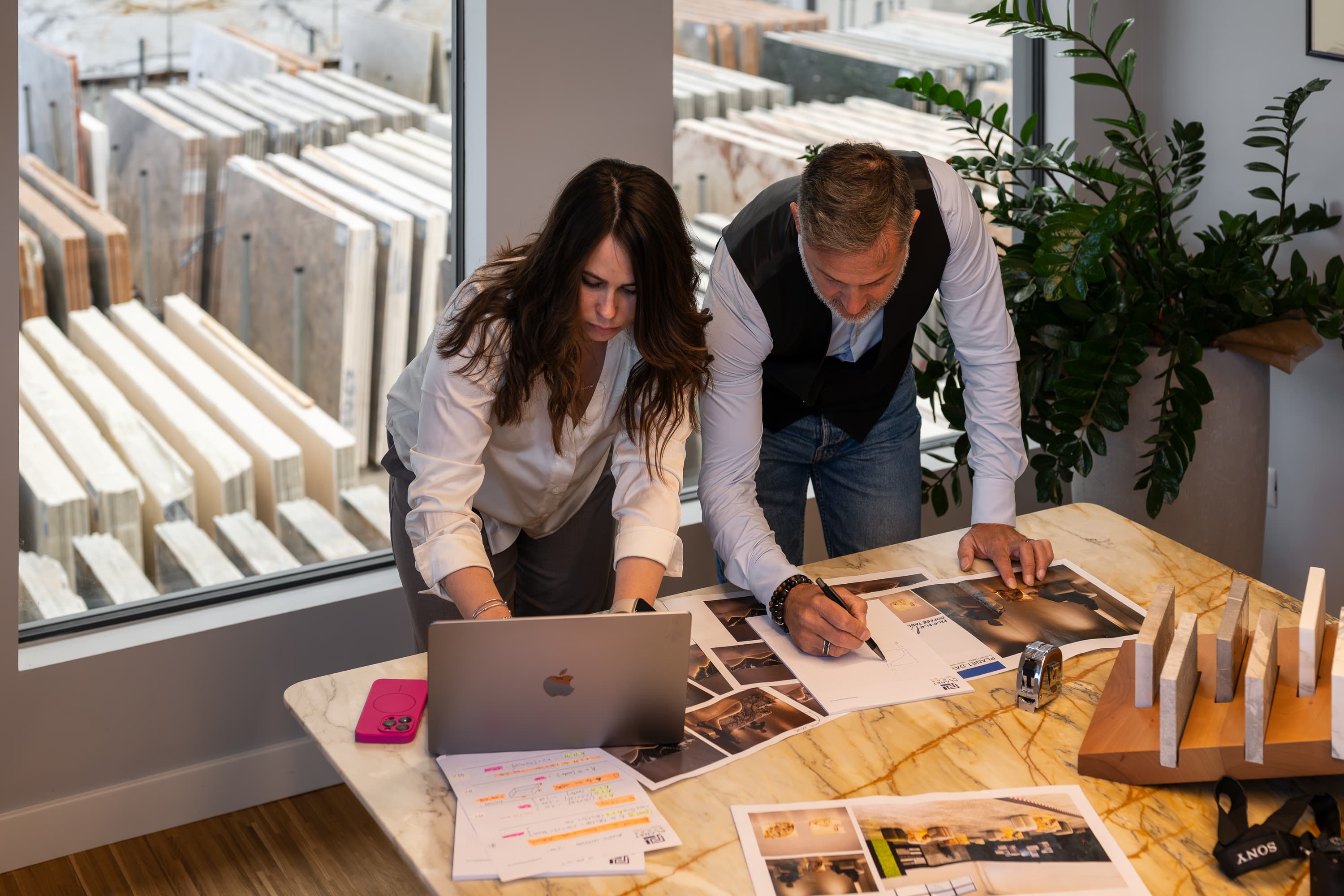 PlanetStone design project team collaborating at a marble table